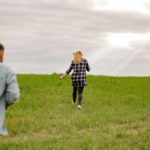 couple chasing each other through the hill, relationship attachment style