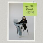 Words of Affirmation on sticky note over a photo of woman with laptop on a chair